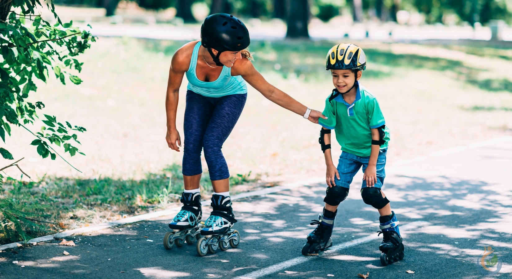 Mom and child roller skating outside in the summer with helmets and padding on
